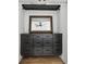 Walk-in closet with built-in vanity, drawers and gold framed mirror at 878 Dill Sw Ave, Atlanta, GA 30310