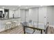 Bright dining area adjacent to kitchen with modern table with seating and breakfast bar at 878 Dill Sw Ave, Atlanta, GA 30310