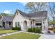 Attractive cottage style home with white painted brick, inviting front porch and manicured landscaping at 878 Dill Sw Ave, Atlanta, GA 30310