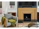 Close-up of modern fireplace with geometric wood surround and black marble hearth at 878 Dill Sw Ave, Atlanta, GA 30310