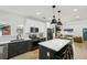 Bright and open kitchen features a central island and stainless steel appliances at 878 Dill Sw Ave, Atlanta, GA 30310
