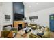 Bright living room with vaulted ceiling, modern fireplace, and comfortable seating area at 878 Dill Sw Ave, Atlanta, GA 30310