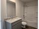 Full bathroom with granite countertop, vanity, and shower/tub combo at 1594 Sungrown Way, Mcdonough, GA 30253