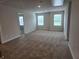 Spacious carpeted bedroom with bright natural light at 1594 Sungrown Way, Mcdonough, GA 30253