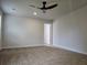 Spacious bedroom features neutral carpet and a modern ceiling fan at 1594 Sungrown Way, Mcdonough, GA 30253