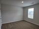 Standard bedroom with neutral paint, carpet, and bright natural light at 1594 Sungrown Way, Mcdonough, GA 30253