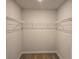 Walk-in closet featuring wire shelving for organized storage at 1594 Sungrown Way, Mcdonough, GA 30253