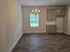 Dining area with gray cabinets and granite countertops with backyard window views at 1594 Sungrown Way, Mcdonough, GA 30253