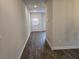 Hallway features wood-look flooring with a door leading to the outside at 1594 Sungrown Way, Mcdonough, GA 30253