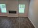 Cozy living room with modern fireplace insert and natural light at 1594 Sungrown Way, Mcdonough, GA 30253
