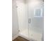 Modern bathroom with a subway tiled shower featuring a clear glass door and brushed nickel hardware at 1594 Sungrown Way, Mcdonough, GA 30253