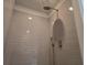 Modern bathroom shower with tiled walls and rainfall shower head at 1594 Sungrown Way, Mcdonough, GA 30253