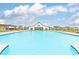 Large community pool offers a refreshing escape with ample space for swimming and relaxation at 1594 Sungrown Way, Mcdonough, GA 30253