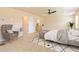 Spacious bedroom featuring soft carpet, neutral colors, and a comfortable seating area at 1595 Sungrown Way, Mcdonough, GA 30253