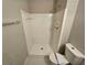 This bathroom features a stand up shower with tiled walls and floors and a modern toilet at 200 Williamsburg Way, Fayetteville, GA 30214
