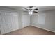 This bedroom has plush carpet, ceiling fan, and a window to let the natural light in at 200 Williamsburg Way, Fayetteville, GA 30214