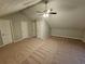 This carpeted bonus room features multiple closets and plenty of space at 200 Williamsburg Way, Fayetteville, GA 30214