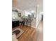Open-concept kitchen featuring white cabinets, granite countertops, stainless appliances, and bar stool seating at 705 Windchase Ln, Stone Mountain, GA 30083