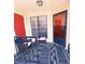 Cozy patio area with woven chairs and a stylish blue patterned rug, perfect for relaxing outdoors at 705 Windchase Ln, Stone Mountain, GA 30083
