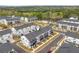 Aerial view showing the layout of the townhome community with a neighborhood pool and manicured landscaping at 823 Mackay Crk, Woodstock, GA 30188