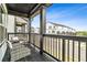 Outdoor balcony area with seating showcasing neighborhood views at 823 Mackay Crk, Woodstock, GA 30188