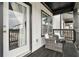 Inviting outdoor balcony area with seating, offering a relaxing space to enjoy the view at 823 Mackay Crk, Woodstock, GA 30188