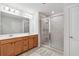 Bright bathroom with double vanity, walk-in shower, and modern fixtures at 823 Mackay Crk, Woodstock, GA 30188