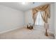 Neutral bedroom with carpet, decorated with stylish window treatments and a bedside table at 823 Mackay Crk, Woodstock, GA 30188