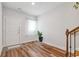 Bright entryway featuring wood-look flooring, staircase, and natural light at 823 Mackay Crk, Woodstock, GA 30188