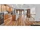 Open concept kitchen showcasing stainless steel appliances, hardwood floors and natural light at 823 Mackay Crk, Woodstock, GA 30188