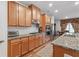 Stylish kitchen featuring granite countertops, wood cabinets, and stainless appliances at 823 Mackay Crk, Woodstock, GA 30188