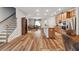 Open concept living area featuring hardwood floors and plenty of natural light at 823 Mackay Crk, Woodstock, GA 30188