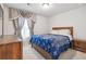 Cozy main bedroom showcasing a comfortable bed, soft carpet, and coordinating furnishings at 823 Mackay Crk, Woodstock, GA 30188