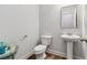 Modern powder room with pedestal sink, and clean design at 823 Mackay Crk, Woodstock, GA 30188