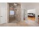 Luxurious glass enclosed shower located inside primary bathroom with a soaking tub at 1159 Thornwell Ne Dr, Brookhaven, GA 30319