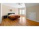 Spacious bedroom featuring hardwood floors, neutral walls, crown molding, and a ceiling fan at 1159 Thornwell Ne Dr, Brookhaven, GA 30319