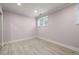 Well-lit bedroom with hardwood flooring and a window providing natural light at 1159 Thornwell Ne Dr, Brookhaven, GA 30319