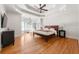 A Primary bedroom suite featuring hardwood floors, recessed lighting, crown molding, tray ceiling and bay window at 1159 Thornwell Ne Dr, Brookhaven, GA 30319