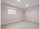 Minimalist bedroom with hardwood floors, white trim, and a window at 1159 Thornwell Ne Dr, Brookhaven, GA 30319