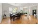 Elegant dining room featuring hardwood floors, chandelier, and decorative columns at 1159 Thornwell Ne Dr, Brookhaven, GA 30319