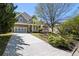 Charming two-story home with stone and siding, featuring a two-car garage, and a meticulously landscaped front yard at 1159 Thornwell Ne Dr, Brookhaven, GA 30319