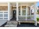 Inviting front porch showcasing stone accents, a bay window, and a stylish front door at 1159 Thornwell Ne Dr, Brookhaven, GA 30319
