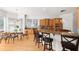 Spacious kitchen featuring a breakfast bar, dining area, stainless steel appliances, and modern lighting fixtures at 1159 Thornwell Ne Dr, Brookhaven, GA 30319