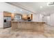 Spacious kitchen with stainless steel appliances, tile floors and breakfast bar at 1159 Thornwell Ne Dr, Brookhaven, GA 30319