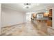 Open kitchen layout with breakfast bar and view to adjacent living area at 1159 Thornwell Ne Dr, Brookhaven, GA 30319