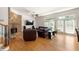 Spacious living room featuring a stone fireplace, hardwood floors, and abundant natural light at 1159 Thornwell Ne Dr, Brookhaven, GA 30319