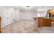 Open-concept living room with tile floors and a kitchen island perfect for entertaining at 1159 Thornwell Ne Dr, Brookhaven, GA 30319