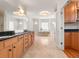 Luxurious main bathroom featuring a double vanity, garden tub, tiled floors, recessed lighting, and wood cabinets at 1159 Thornwell Ne Dr, Brookhaven, GA 30319