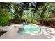 Gorgeous in-ground pool and spa surrounded by lush greenery and comfortable lounge chairs at 1159 Thornwell Ne Dr, Brookhaven, GA 30319