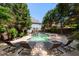 Beautifully landscaped backyard featuring a pool, spa, and lounge area for relaxation and enjoyment at 1159 Thornwell Ne Dr, Brookhaven, GA 30319